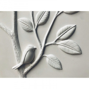 sculpture oiseau sur une branche de citronnier en bas-relief